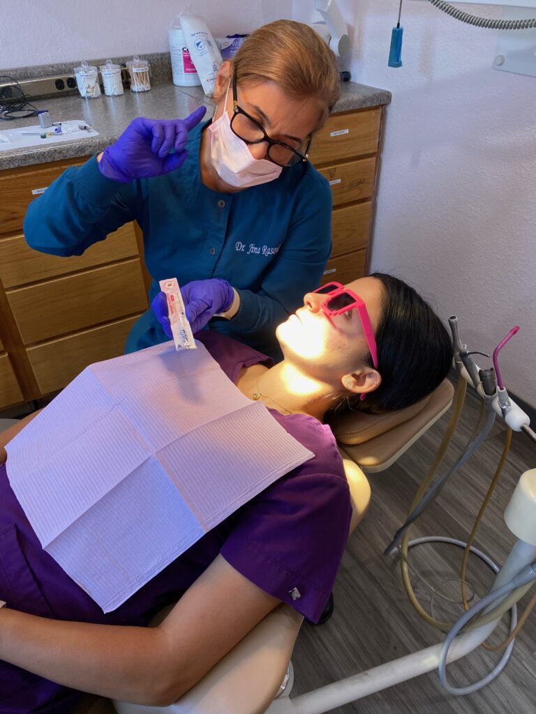Dr. Jina advising a patient on how to prevent cavities from getting worse